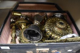 A selection of metal wares in vintage suitcase including brass candle sticks and trophy etc