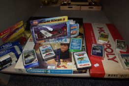 A selection of board games, top trump card packs and diecast Matchbox vehicle