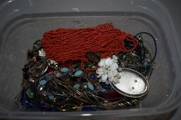 A selection of costume jewellery necklaces and brooches etc