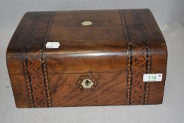 An antique sewing case having veneer case with parquetry design