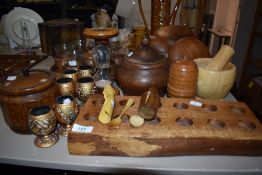A selection of treen wood items including teak salad bowls, oak tea caddy and decorated egg cups