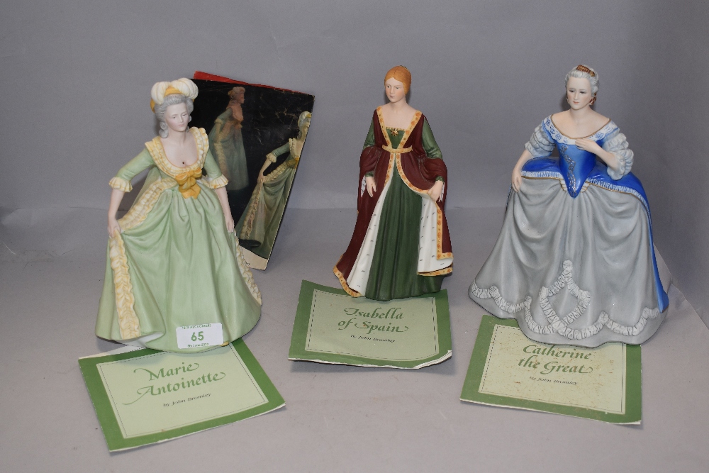 A group of three Franklin mint figures