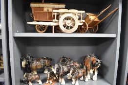 A selection of model gypsy caravans and a good selection of ceramics shire horse figures