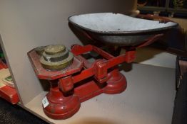 A set of vintage kitchen balance scales and weight set