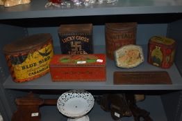 A selection of vintage tins to include lucky cross toffee, co-op east west homes best biscuits and a