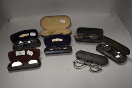 Seven pairs of antique spectacles or eye glasses some having yellow metal frames