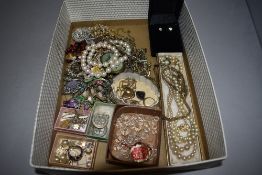 A selection of costume jewellery including brooches, earrings, chains etc