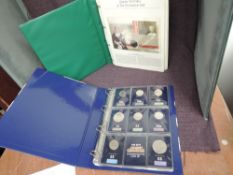 A collection of UK Coins in 2 albums including Coin Covers, 50 Pence's, Two Pounds and Five Pounds