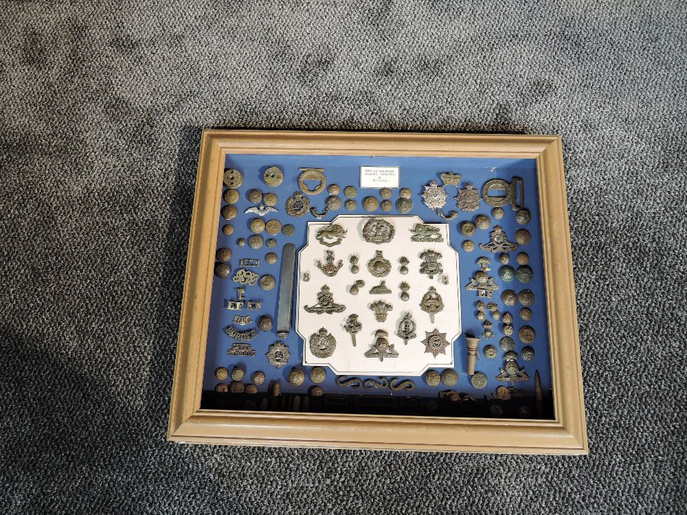 A Framed case of Detector Finds British Military Badge, Insignia and Buttons including Border
