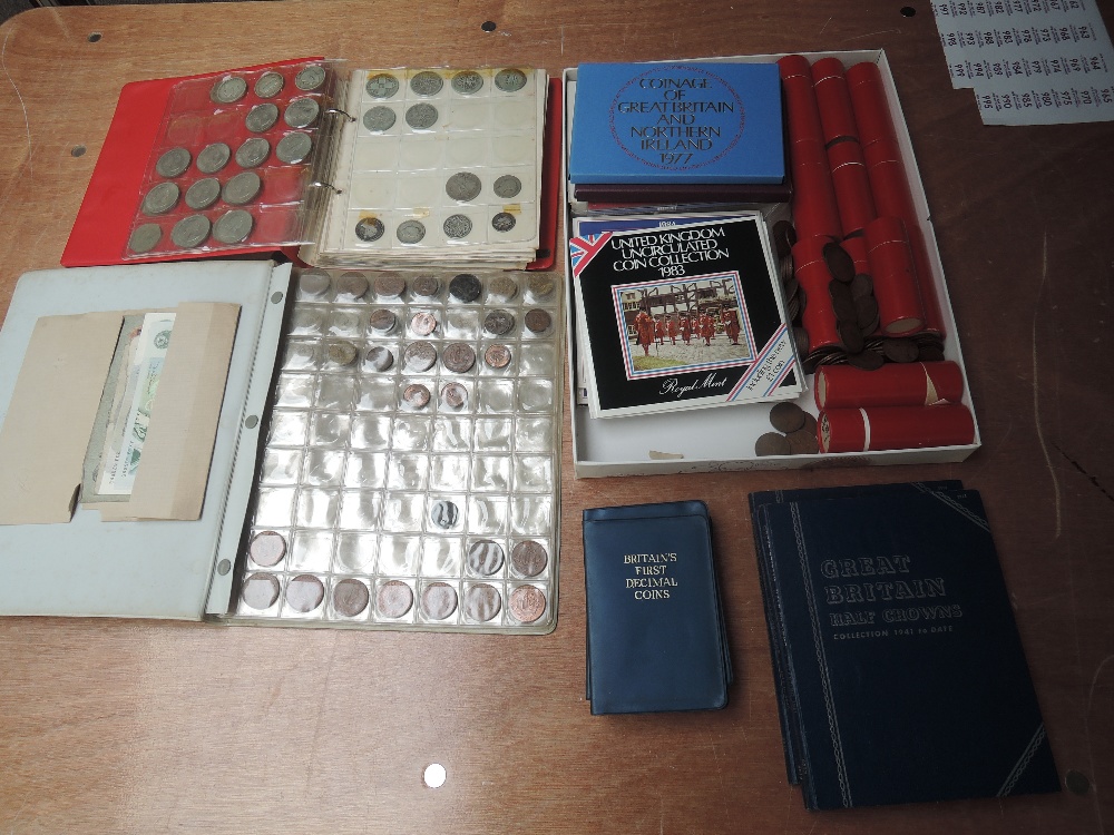 A collection of mainly GB Coins & Banknotes including Year Sets 1967,1970, 1977, 1982, 1983 x3, 1984