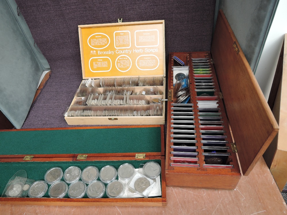 Three wooden boxes of coin, two containing modern Crowns including GB and...