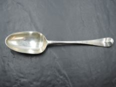 An early 18th Century Georgian silver table spoon of Hanoverian form bearing crest to reverse of