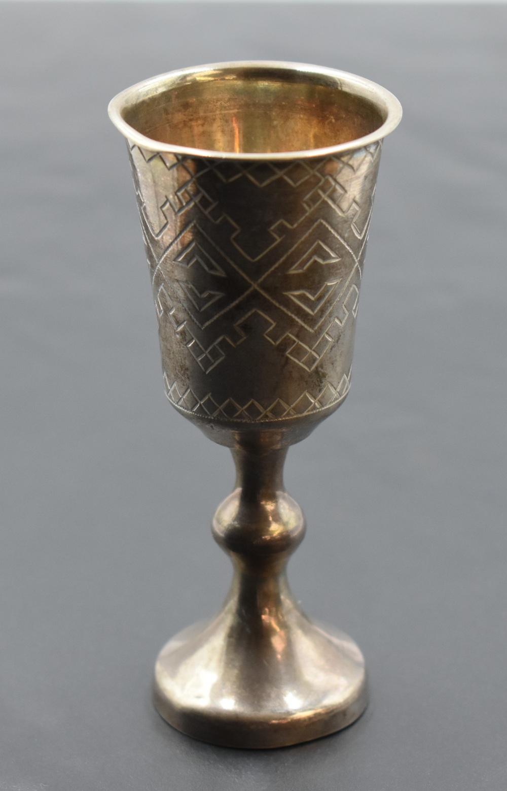 Two 19th century Russian white metal Kiddush cups, with marks for Moscow 1884 and 1886, each