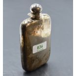 An Edwardian silver hip flask, of rounded rectangular form, curved for the gentleman's pocket, marks