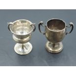 Two small early 20th century two-handled silver trophies, each with engraved inscriptions, marks for