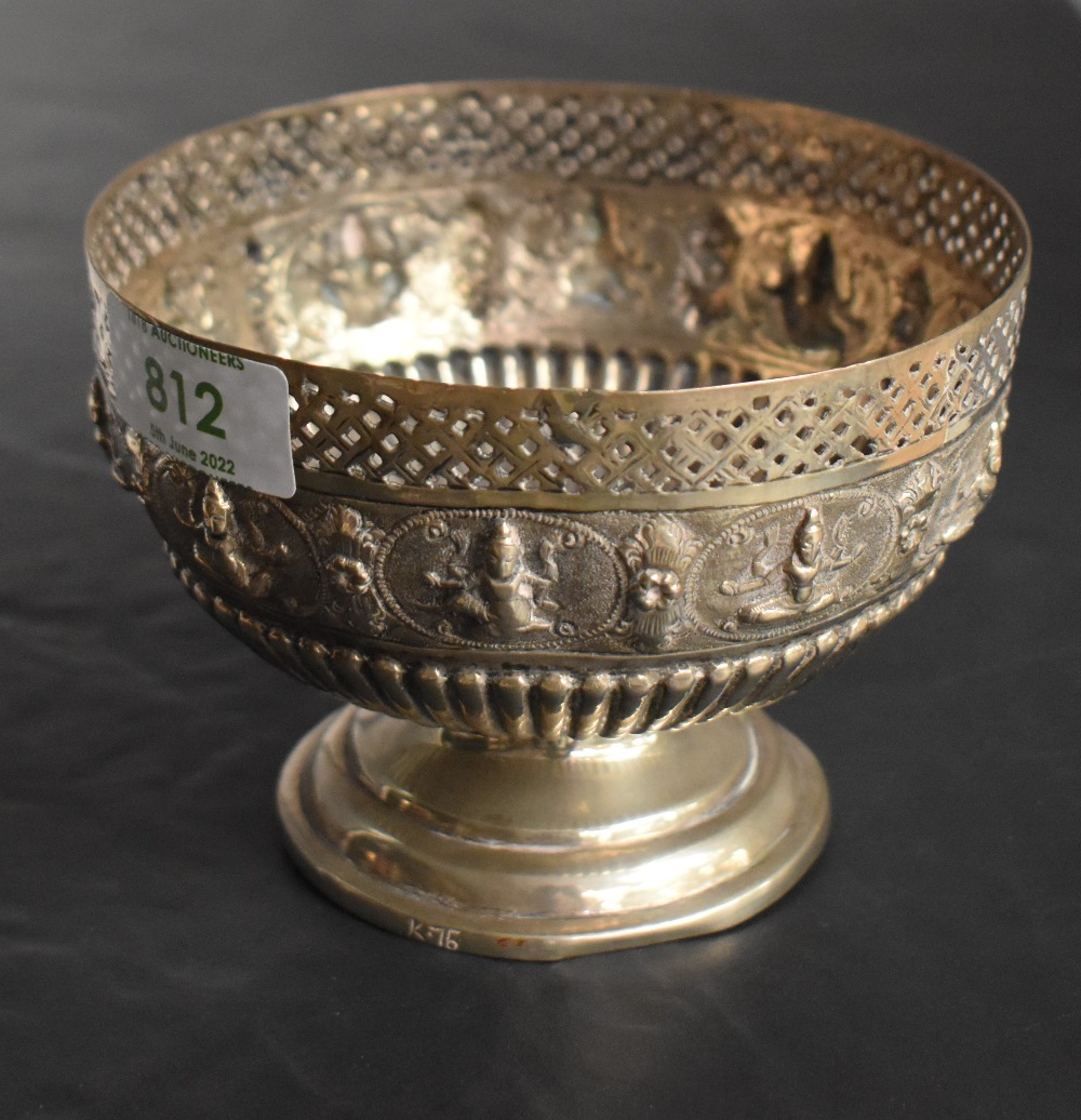 An Indian silver bowl having gadrooned and pierced decoration with central panel bearing images of