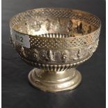 An Indian silver bowl having gadrooned and pierced decoration with central panel bearing images of
