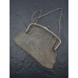 A silver mesh evening bag with clip clasp and carry chain, London 1919, Heasman & Co, bearing import