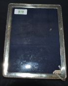 A late 20th century silver mounted photograph frame, of rectangular form with beaded edge