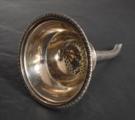 A George III Scottish silver wine strainer, of circular form with gardrooned rim and pierced