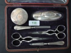 A cased silver mounted manicure set, marks for Sheffield 1910/11, maker James Dixon & Sons, the