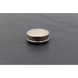 An Edwardian silver pill box, of plain circular form with gilt interior, marks for Birmingham