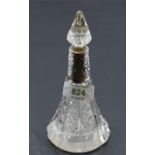 An Edwardian cut glass perfume bottle of conical form having cut glass stopper and moulded silver