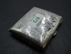 A late Victorian silver cigarette case, of hinged rectangular form and curved for the gentleman's
