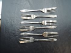 A set of six 1930's silver cake forks, with shaped and moulded terminals, marks for Sheffield