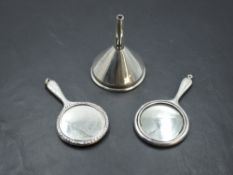 Two miniature early 20th Century silver hand mirrors of traditional form, and a small Edwardian