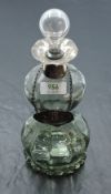 A Victorian pale green glass waisted decanter having silver frilled rim and glass stopper, London