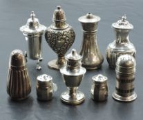 A group of nine mixed silver condiments, various sizes, designs, dates and makers, gross weight