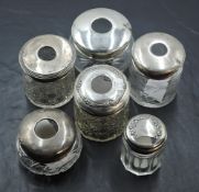 A group of six silver topped glass hair tidies, varying size, design, dates and makers, gross silver