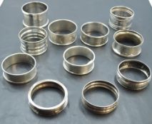 A group of eleven silver napkin rings, various designs, dates and makers, mainly early 20th century,