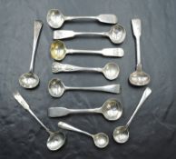 A group of eleven 19th century condiment spoons, mainly Georgian, each with differing design, date