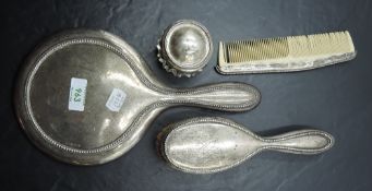 A Sterling silver mounted three-piece dressing table brush set, each with bead-moulded decoration,