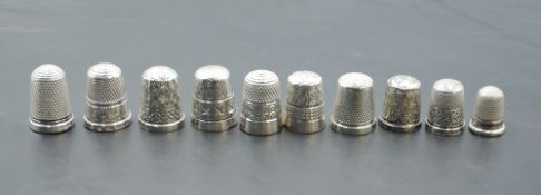 Nine HM silver thimbles of various dates and forms including Charles Horner and a DORCAS white metal