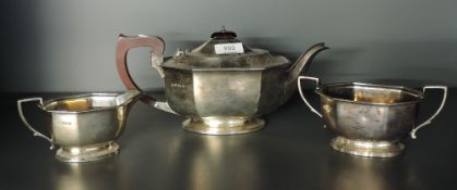 A mid-20th century silver three-piece teaset, comprising teapot, sugar and cream, each of canted