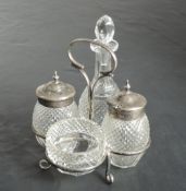 A small Edwardian silver and cut glass condiment set, Birmingham 1902, T H Hazelwood & Co