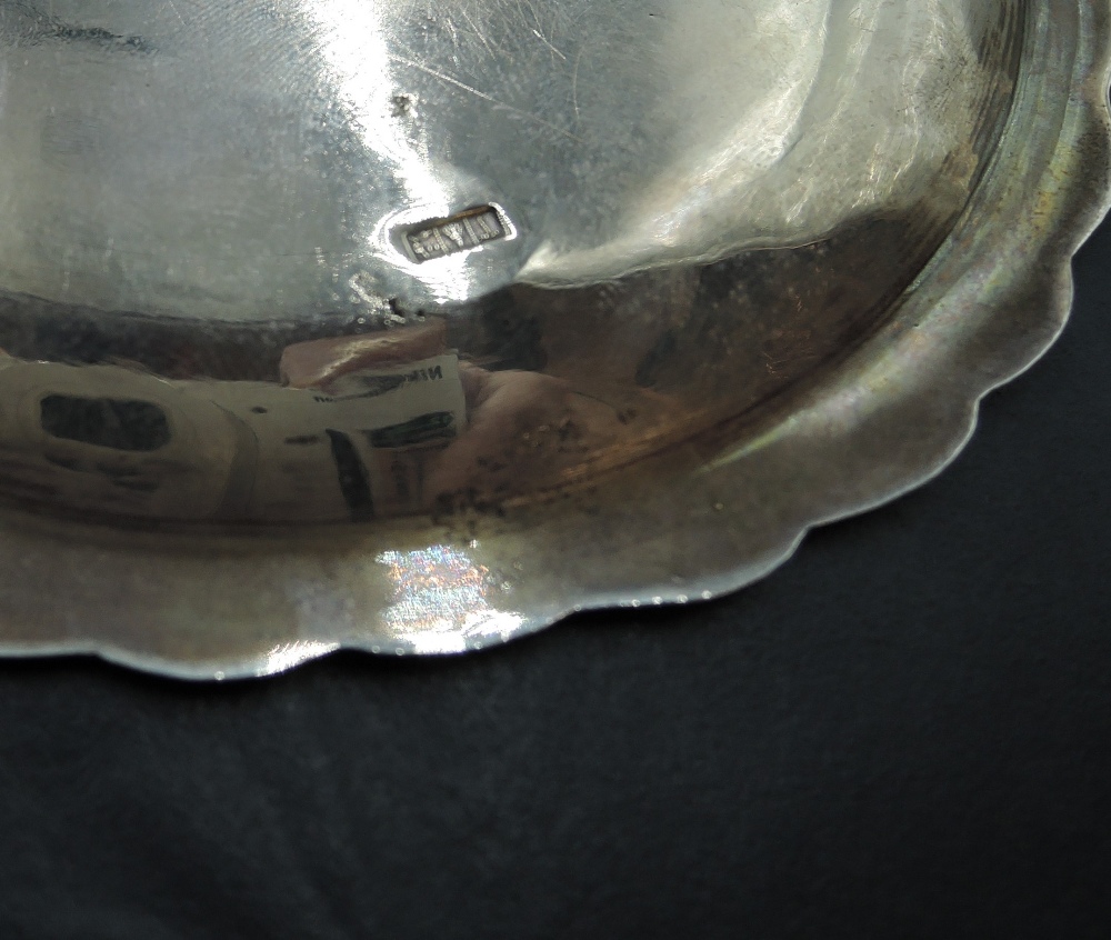 An Egyptian silver bottle saucer having extensive engraved decoration and shaped rim, approx 68.7g - Image 2 of 2
