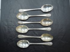 A Set of six Edwardian silver spoons, with fluted edge detail and scrolled cartouches, engraved