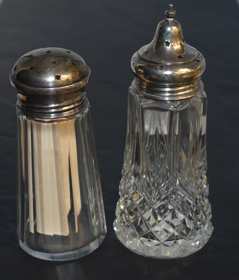 Two early 20th century silver topped sugar sifters, each with star-cut screw-off tops, marks for