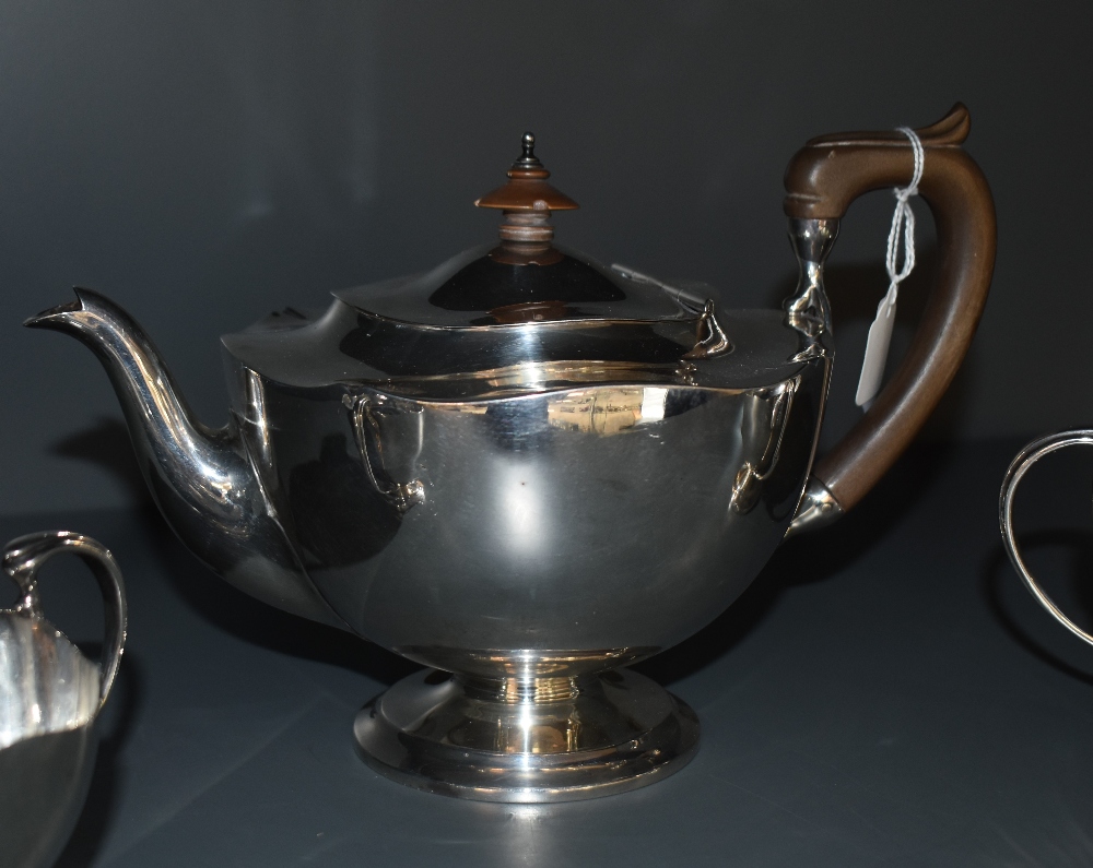 A 1920's three piece silver teaset, of circular form with shaped rims, marks for Sheffield 1922, - Image 2 of 5