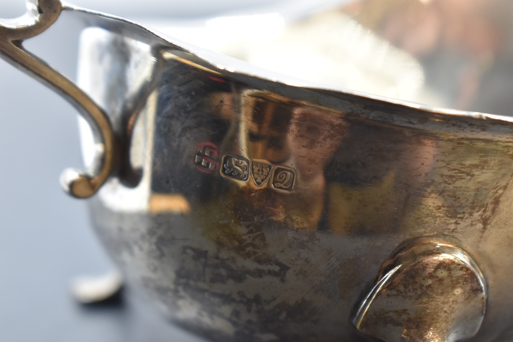 An early 20th century silver gravy boat, of generous proportions with scrolled handle and trefoil - Image 4 of 4