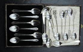 A cased set of six HM silver coffee spoons, six Dutch silver spoons having moulded floral terminals,