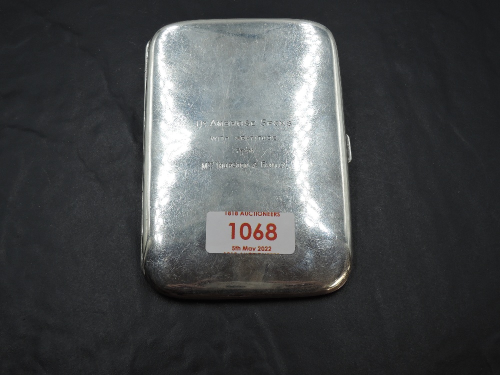 An Early 20th century silver cigarette case, of rounded rectangular form, the plain body with