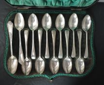 A cased set of six Edwardian silver coffee spoons having moulded detail to terminals, Birmingham