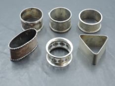 A group of six silver napkin rings, various dates, makers and design, 160grams gross.