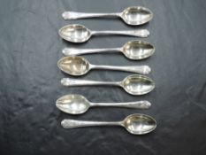 A group of seven 1930's golfing interest coffee spoons, the trefoil terminals with crossed golf club