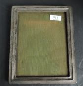 A silver rectangular photograph frame having wooden easelstand, Birmingham 1922, makers mark M &